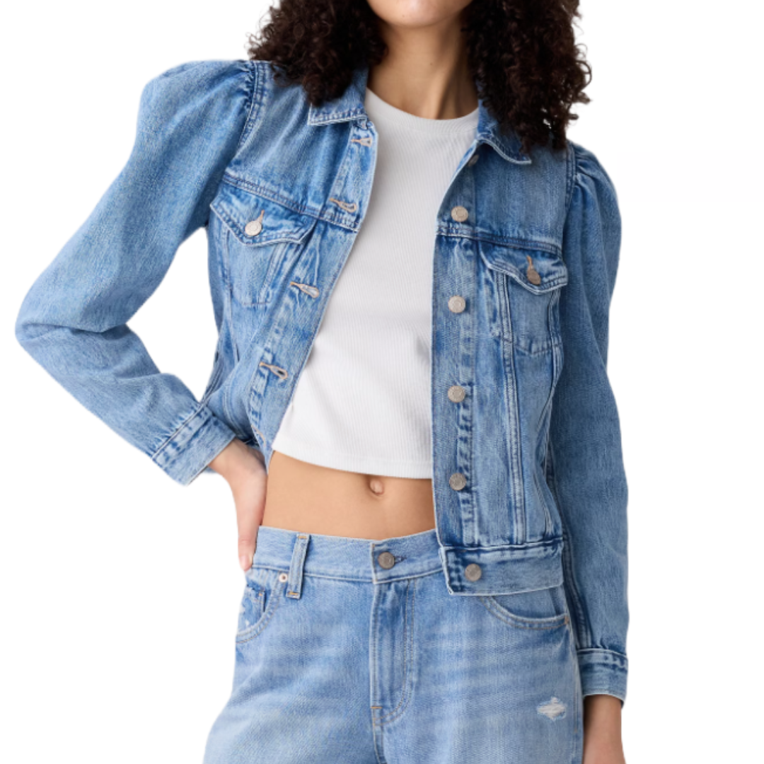 A blue denim jacket with puffed shoulders, button closures, and chest flap pockets, paired with matching denim jeans and a white ribbed crop top.