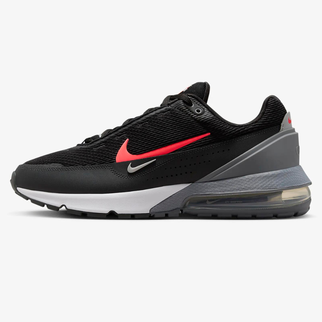 A black athletic shoe with a red swoosh logo and visible air cushioning in the sole.
