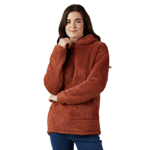 A woman is wearing a cozy, brown, plush hooded sweater paired with blue jeans, set against a plain gray background.