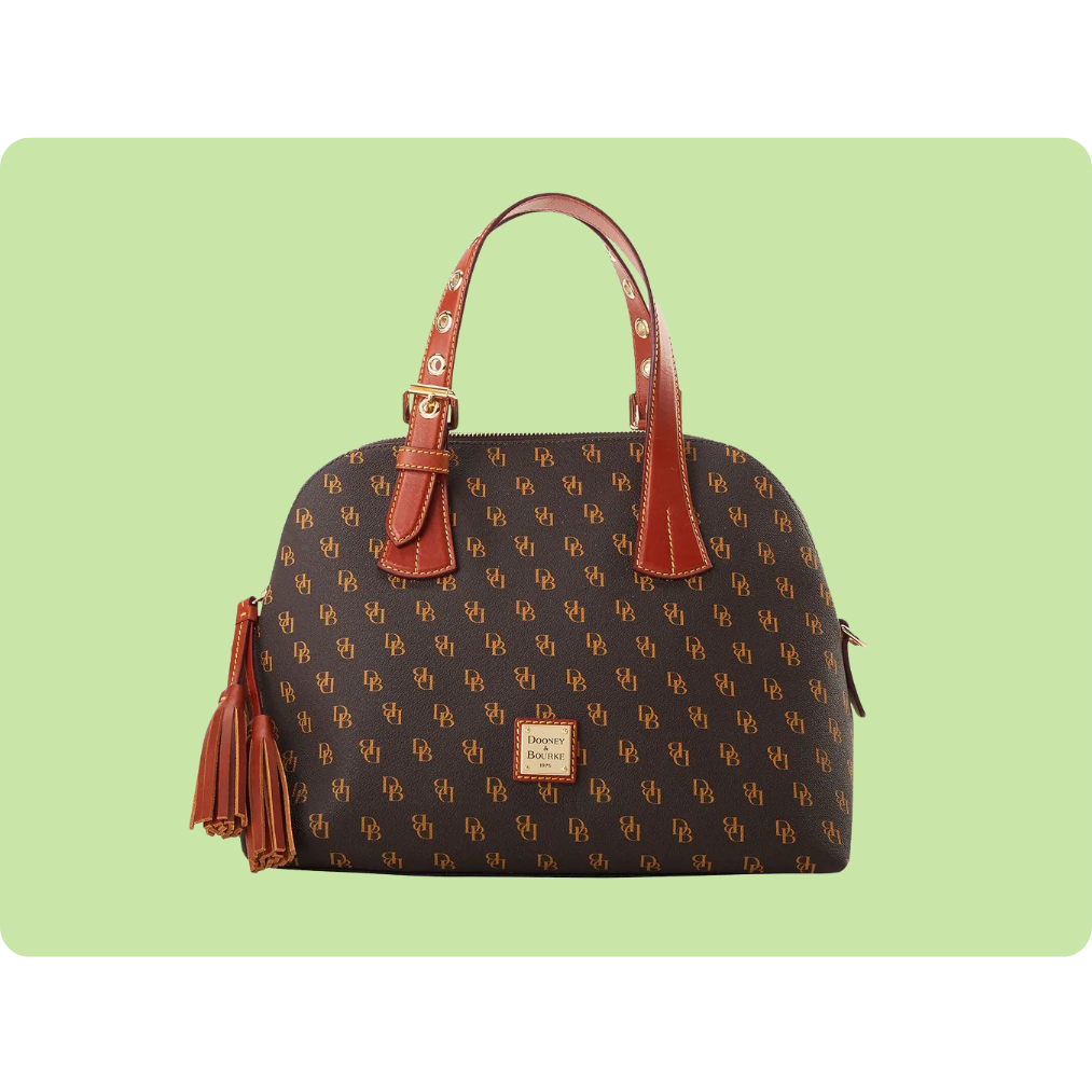 A Dooney & Bourke tote bag featuring a brown patterned exterior with the brand's logo and red leather handles, accented with gold hardware and tassel detailing.