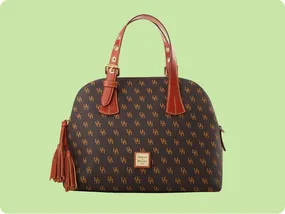 A Dooney & Bourke tote bag featuring a brown patterned exterior with the brand's logo and red leather handles, accented with gold hardware and tassel detailing.