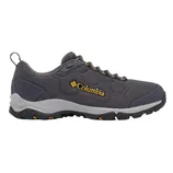 Columbia hiking shoe in dark gray with a textured fabric, featuring a yellow logo, sturdy sole with orange accents, and heel loop for easy handling.