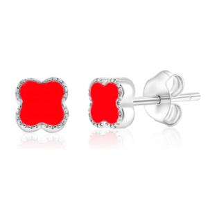 Silver studs with red turquoise in a clover shape, featuring a sleek metal border and secure post backs.