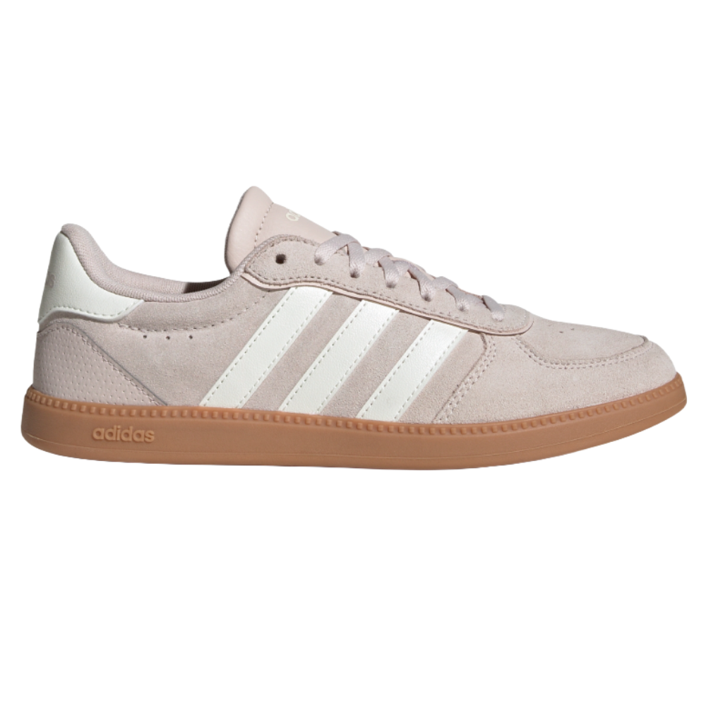 A light pink suede Adidas sneaker with white stripes and a gum sole.