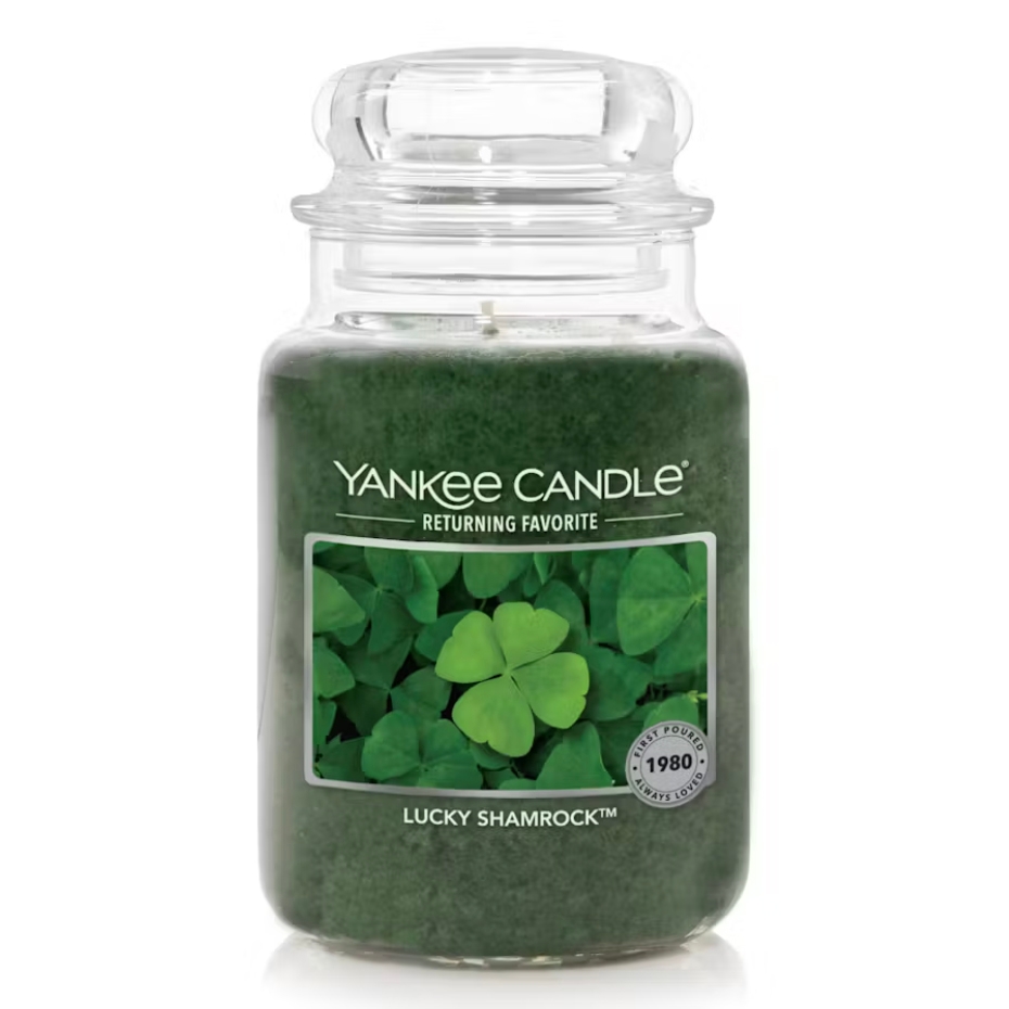 Yankee Candle 22oz jar in the \“Lucky Shamrock\“ scent, a returning favorite featuring a green candle with a shamrock image on the label.