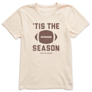 A beige T-shirt features a graphic of a football with the text \“'Tis the Season\“ and \“Life is Good\“ beneath it.
