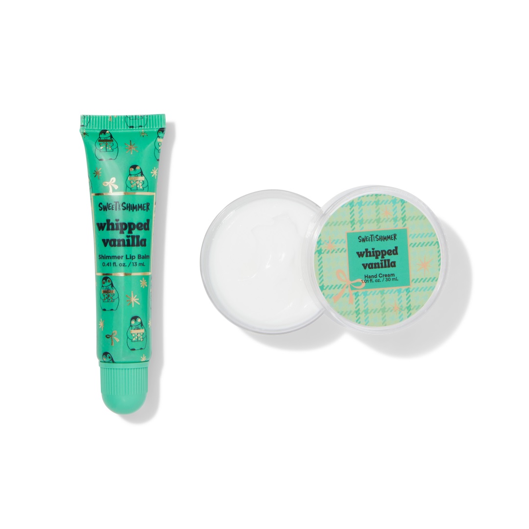 Sweet & Shimmer Whipped Vanilla Shimmer Lip Balm (0.41 fl oz/13 ml) and Hand Cream (1 fl oz/30 ml) in green packaging with holiday-themed designs.