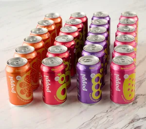 Cans of \“poppi\“ prebiotic soda with flavors: Orange, Cherry Limeade, Grape, and Strawberry Lemonade, each containing 5g of sugar.