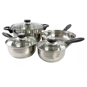 A stainless steel cookware set includes three pots with glass lids and a frying pan, all with black handles.