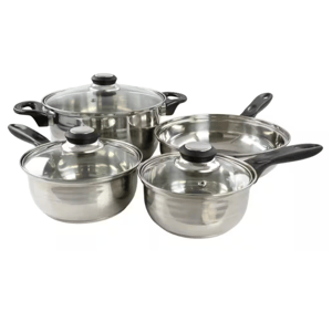 A stainless steel cookware set includes three pots with glass lids and a frying pan, all with black handles.