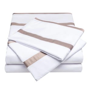 A 4-piece Italian luxury sheet set featuring white sheets with elegant taupe stripe accents.