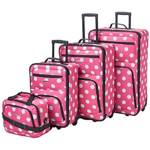 Set of four pink polka dot luggage pieces, including three suitcases of varying sizes with wheels and extendable handles, and one small bag.