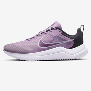 A lavender Nike sneaker with a white sole and black detailing.
