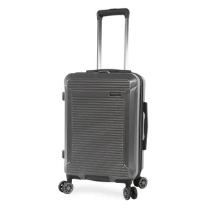 A grey hard-shell suitcase with four spinner wheels, telescopic handle, and textured exterior design.