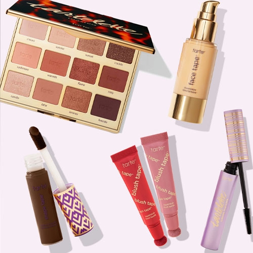 A variety of Tarte cosmetics, including an eyeshadow palette, foundation, concealer, lip products, and mascara.