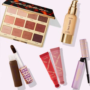 A variety of Tarte cosmetics, including an eyeshadow palette, foundation, concealer, lip products, and mascara.