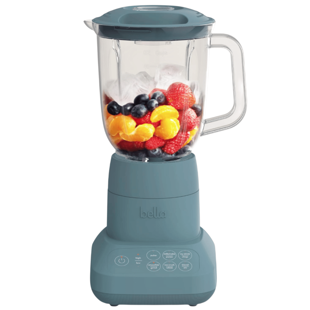 A blue Bella blender with a transparent jar containing assorted fruits like strawberries, raspberries, blueberries, and orange segments. The control panel displays options for blending, chopping, and grinding.