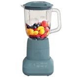 A blue Bella blender with a transparent jar containing assorted fruits like strawberries, raspberries, blueberries, and orange segments. The control panel displays options for blending, chopping, and grinding.