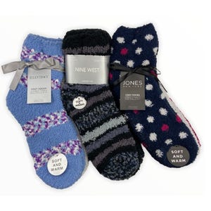 Three pairs of cozy winter socks in various patterns and colors, each with a branded tag from Ellen Tracy, Nine West, and Jones New York.