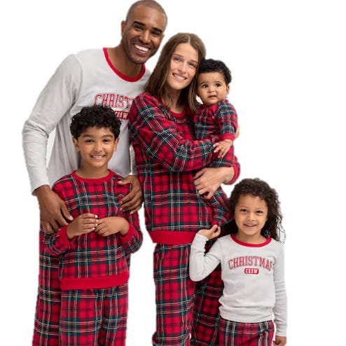 A family wearing matching red plaid pajamas, with \“Christmas Crew\“ and \“Christmas\“ printed on the shirts. The set includes pajamas for adults and children.