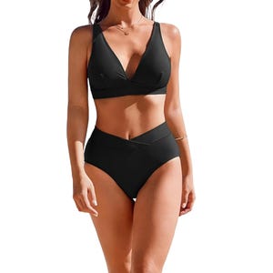 A black bikini set featuring a V-neck top and high-waisted bottoms with a cross-over detail.
