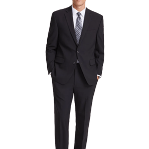 A man wearing a Perry Ellis suit; it's a two-button, dark suit with notched lapels, paired with a white dress shirt and a patterned tie.