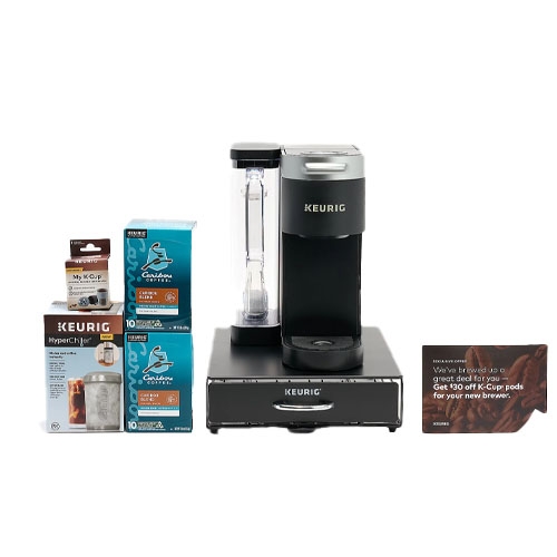 Keurig coffee maker set with a HyperChiller, two boxes of K-Cup pods, and a card offering a discount on future K-Cup purchases.