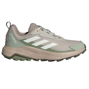 Green and beige Adidas Terrex trail running shoe with white stripes and textured sole.