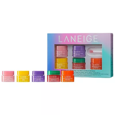 Five colorful jars of Laneige lip sleeping mask are arranged in front of their rainbow-themed packaging.