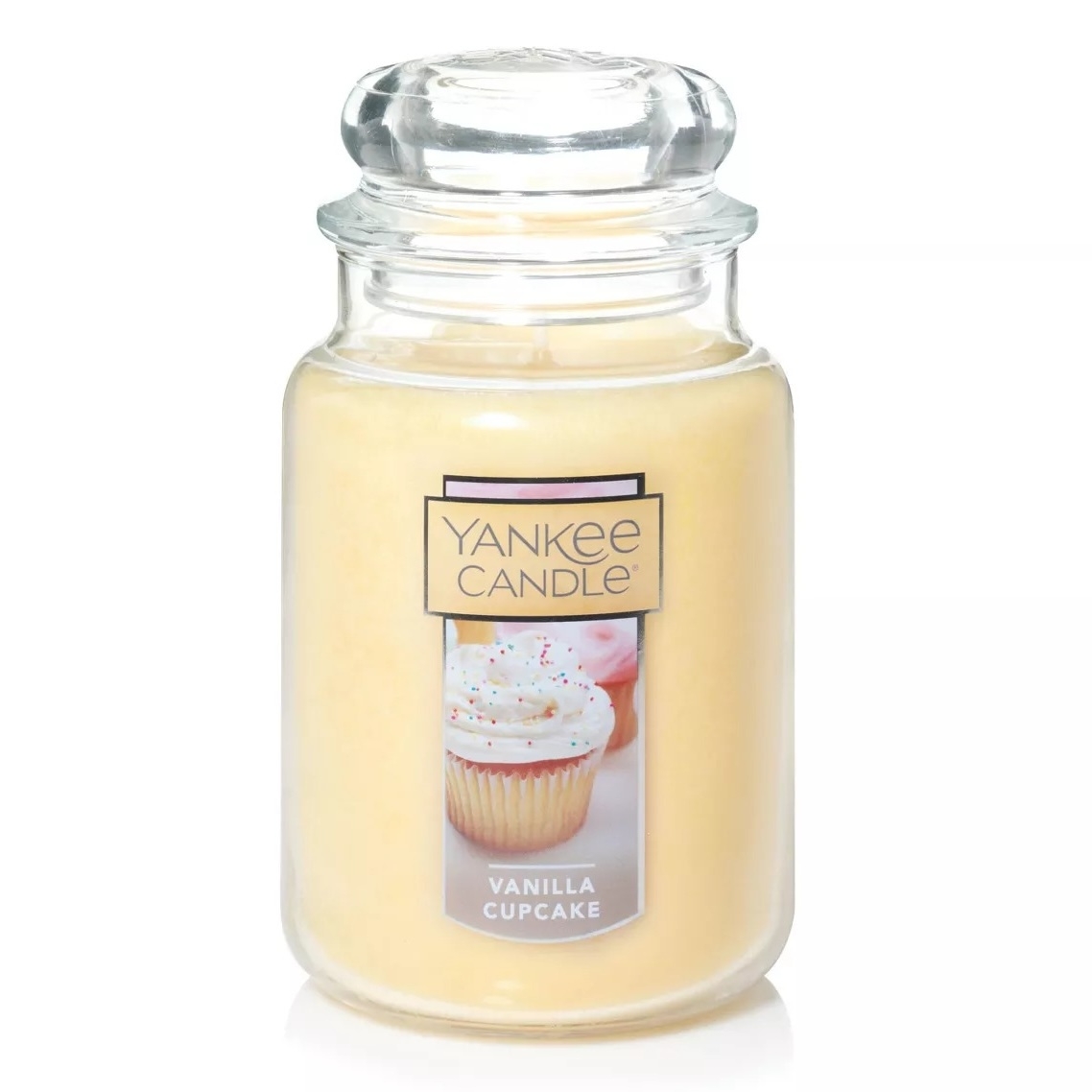 Yankee Candle jar with \“Vanilla Cupcake\“ scent, featuring a creamy wax and cupcake image on the label.