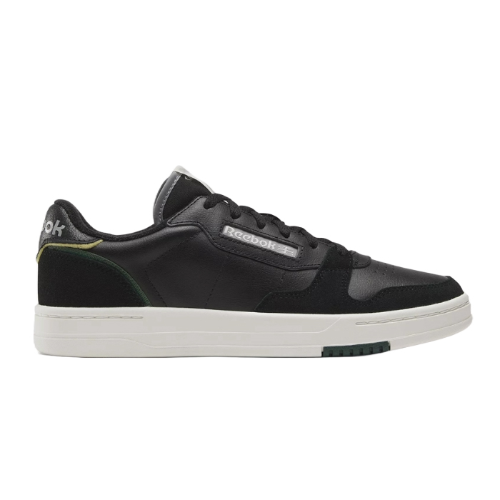 Black Reebok Phase Court Shoes feature a low-cut design with a synthetic leather upper, white sole, and subtle green and yellow accents on the heel. The Reebok logo is displayed on the side.