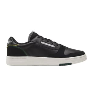 Black Reebok Phase Court Shoes feature a low-cut design with a synthetic leather upper, white sole, and subtle green and yellow accents on the heel. The Reebok logo is displayed on the side.