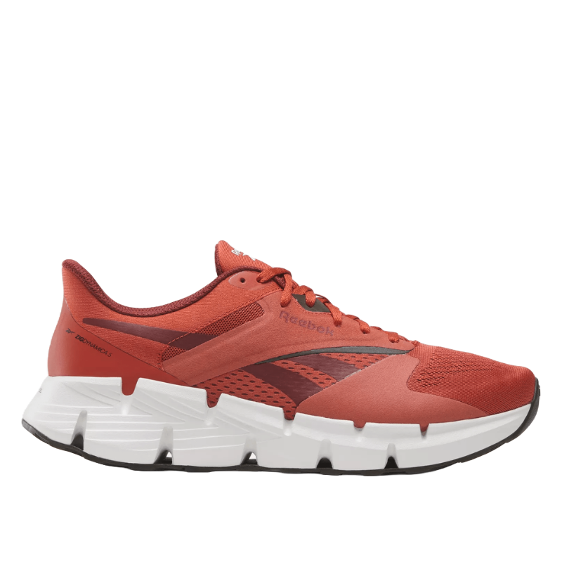 Reebok Zig Dynamica 5 Shoes feature a bold design with a vibrant orange upper, breathable mesh panels, and a distinctive zigzag sole for enhanced cushioning and style.