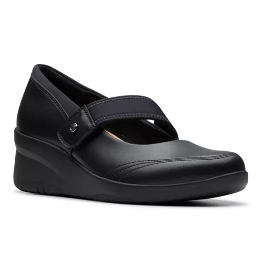 Black leather wedge shoes with a Mary Jane design, featuring a broad strap across the top for secure fastening and a comfortable cushioned sole. The shoes have a subtle stitch detail and a slightly elevated sole for added support.