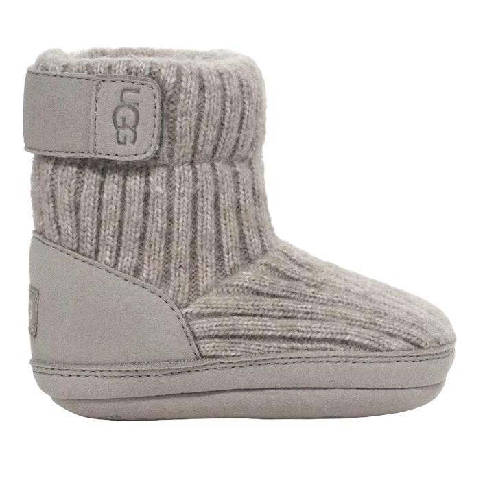 A gray UGG baby boot with a knit upper and soft sole, featuring a Velcro strap for easy fastening.
