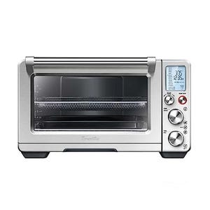 This is a Breville Smart Oven Air Fryer Pro, a stainless steel countertop appliance with digital display featuring dials and buttons for various cooking functions.