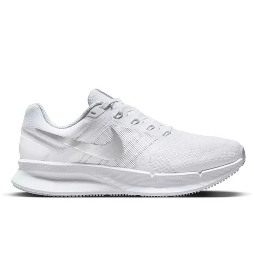 A white athletic shoe with a sleek design and a prominent swoosh logo, featuring a mesh upper and cushioned sole.