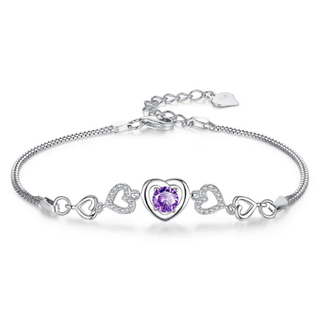 A silver bracelet featuring a central purple heart-shaped gemstone surrounded by hollow heart-shaped designs, some with embedded crystals.
