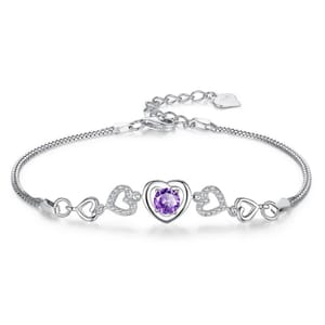 A silver bracelet featuring a central purple heart-shaped gemstone surrounded by hollow heart-shaped designs, some with embedded crystals.