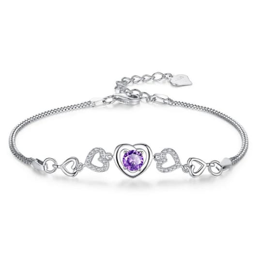 A silver bracelet featuring a central purple heart-shaped gemstone surrounded by hollow heart-shaped designs, some with embedded crystals.