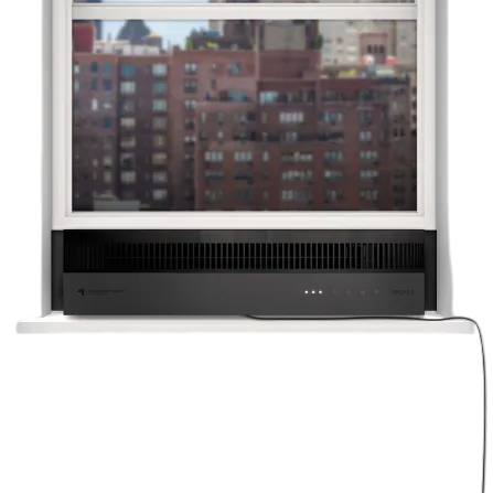 A black window air conditioner unit is installed in a window with a cityscape visible in the background.