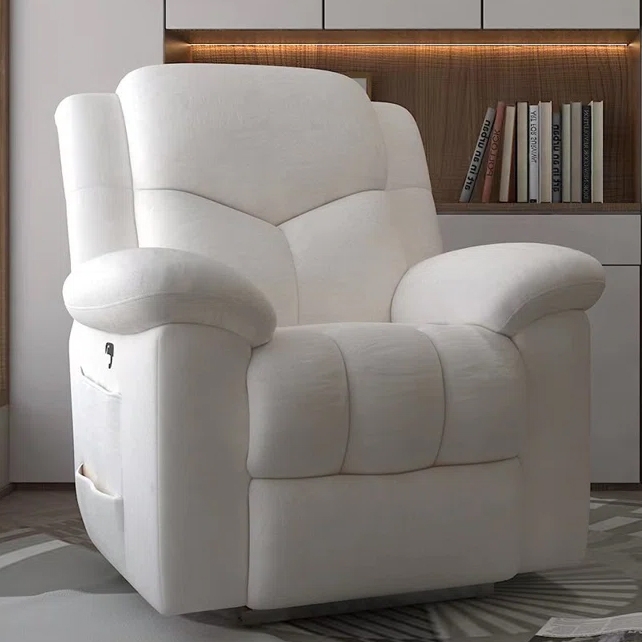Modern white power recliner with plush cushioning, featuring armrests, a side pocket, and a USB port, set against a stylish bookshelf backdrop.