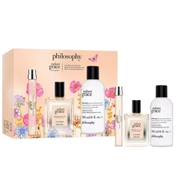 Philosophy Radiant Grace set includes an eau de parfum spray, rollerball, and a 180 ml body lotion. The packaging features floral designs and a light peach background.
