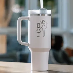 A white travel mug with a handle and lid features a simple stick figure drawing of two people with hearts.