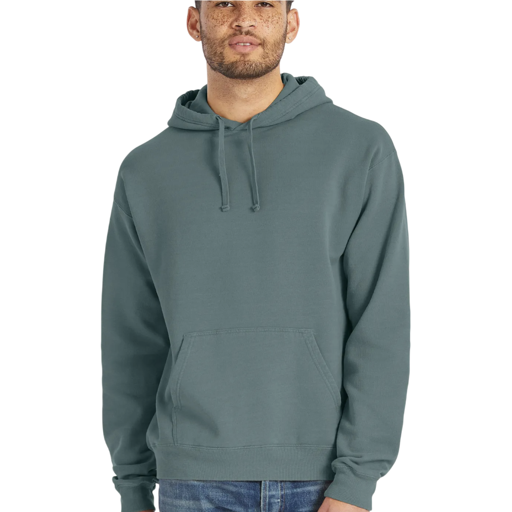 A person models a teal hooded sweatshirt with a front pocket and adjustable drawstrings, paired with blue jeans.