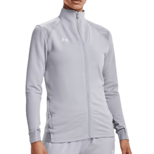 Light gray full-zip jacket with a high collar, featuring the Under Armour logo on the left chest. The jacket is paired with matching pants, creating a coordinated athletic warm-up set.
