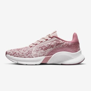 A single pink-toned sports shoe with a speckled sole and knitted upper design.