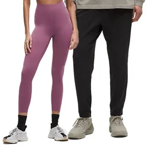 A pair of high-waisted purple leggings and a pair of black jogger pants, both worn with casual sneakers.