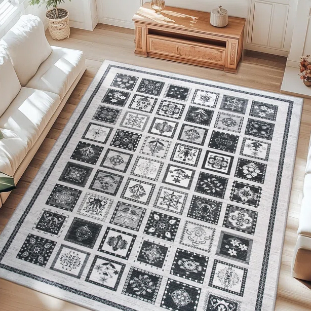 A decorative area rug featuring a grid of black and white square patterns is placed in a bright living room with light wooden floors, surrounded by white sofas and a wooden table.