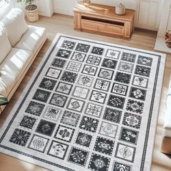 A decorative area rug featuring a grid of black and white square patterns is placed in a bright living room with light wooden floors, surrounded by white sofas and a wooden table.